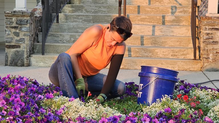 Garden Sage crew installing seasonal planters and lighting